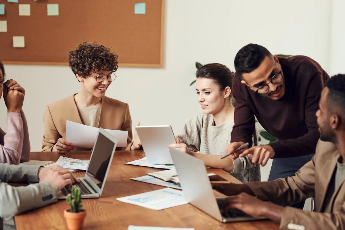 Small business owners at a workshop table planning their new website