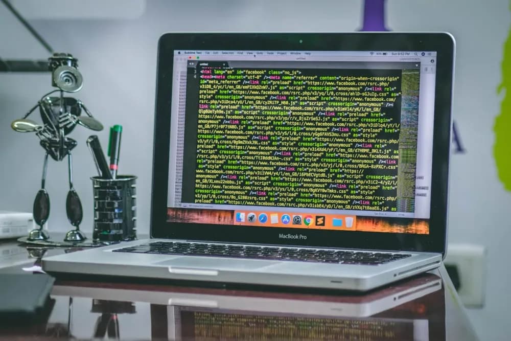Modern web development workspace with code editor showing a Mississauga small business website build